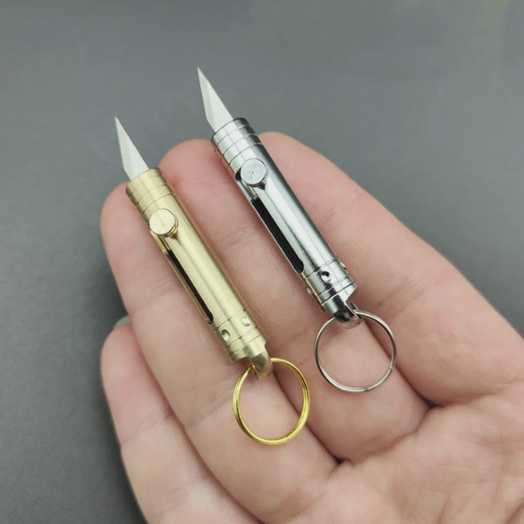 Mini cuchillo retractil de laton